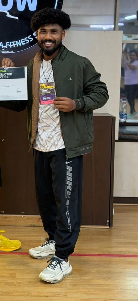 Ajay, Zumba instructor, holding his Zumba instructor licence