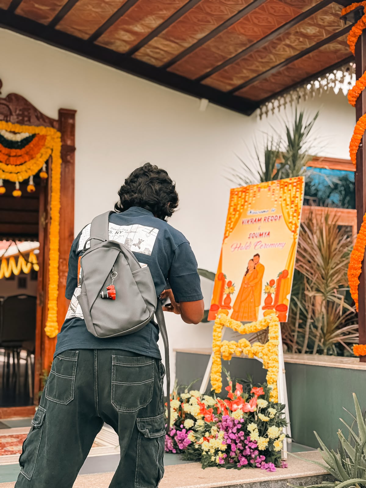 Manohar, the studio's cameraman, photographing an event