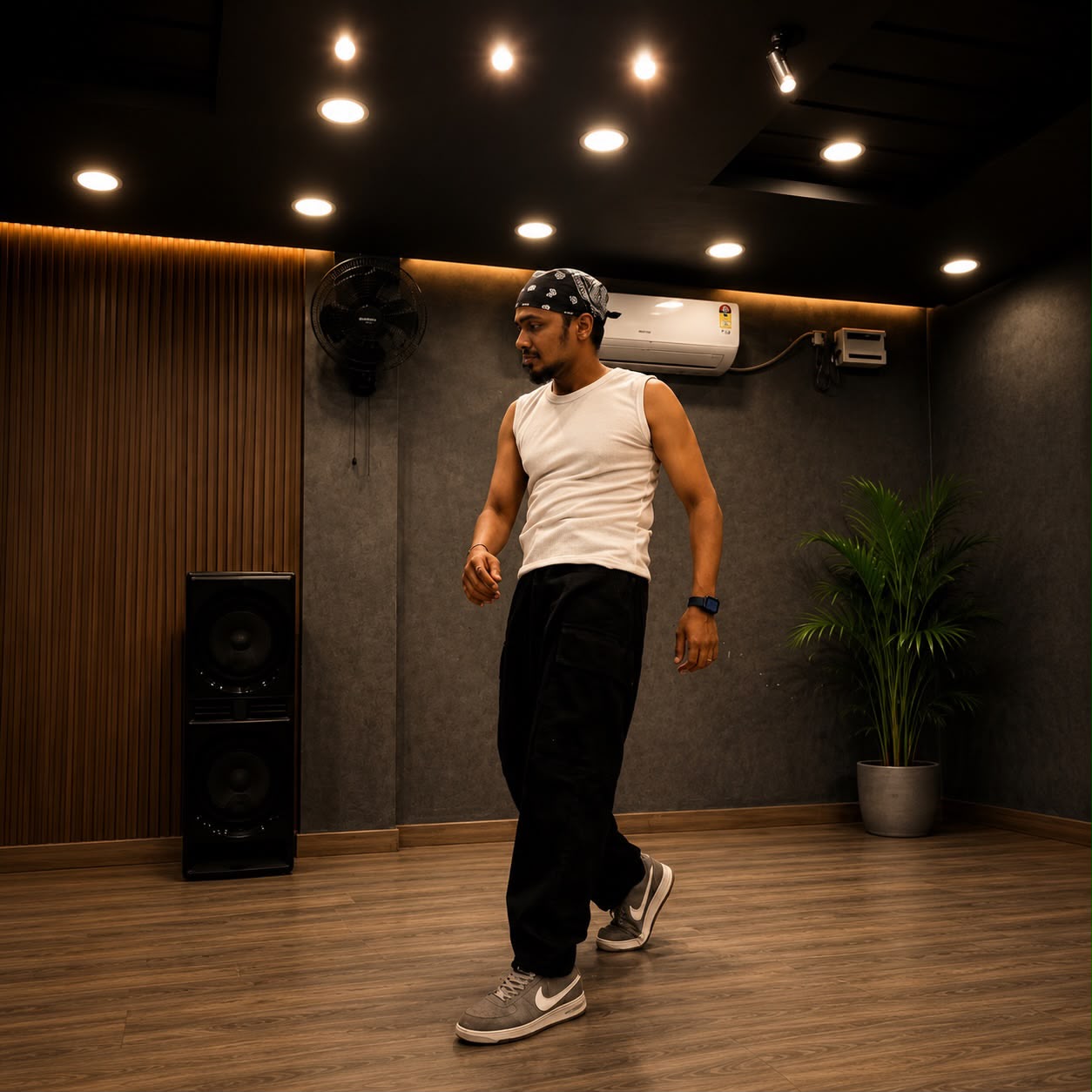 Sonu MJ, dance instructor, mid-move on the studio floor